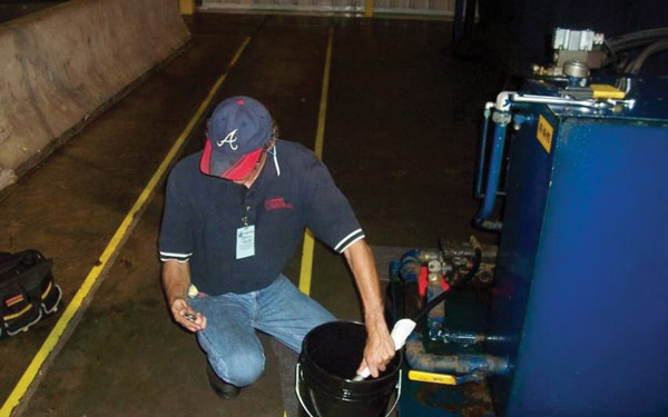 Figure 2. Check oil flow by porting the case drain line into a container of a known size and timing the flow rate. Figure 2. Check oil flow by porting the case drain line into a container of a known size and timing the flow rate.