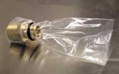 Zip lock plastic bag attached to purge port