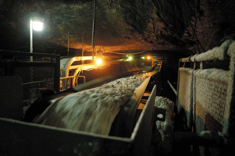 Salt is loaded onto a conveyor system for transfer to the milling operation, which crushes and screens the salt into a usable product before transporting it to the surface.