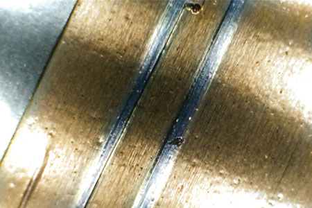 This is an example of a hard particle found in a grease sample.