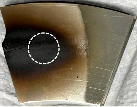 Figure 2: Bearing pad showing a dark patch of deposits at the highest load zone of the bearing. Deposit characterization of this deposit revealed that it was composed of phosphorus-based EP deposits.