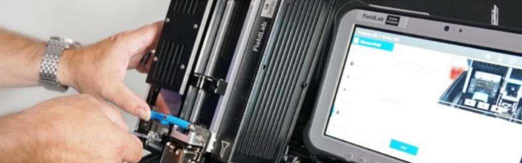 Figure 2. Inserting FPQ Filtergram specimen in position for XRF x-ray fluorescence of the filter active area